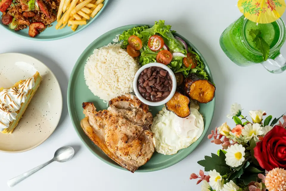 Casado with grilled chicken, rice, beans, sweet plantain and salad